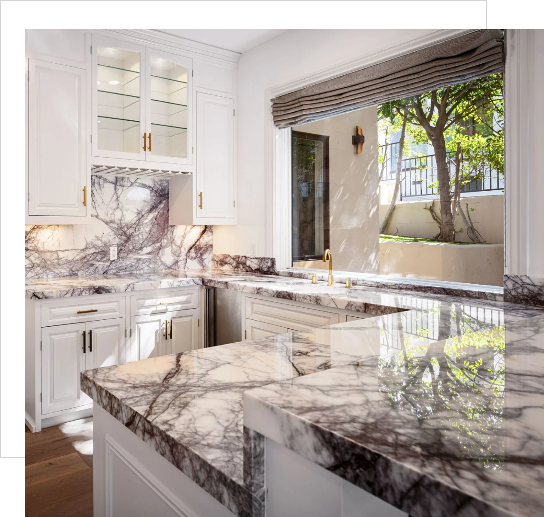 Bright kitchen featuring marble surfaces